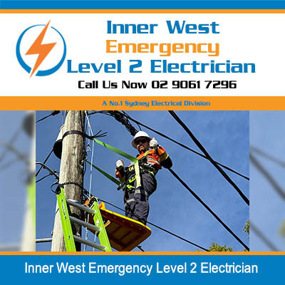 Workers in safety gear working on power lines in Inner West