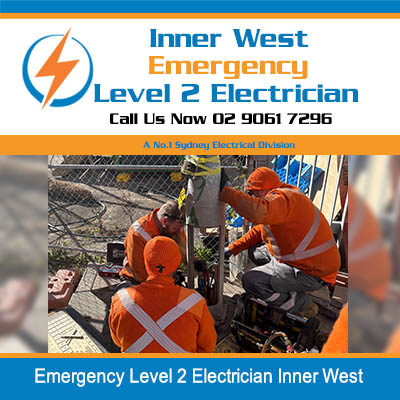 Workers working on electrical equipment in Inner West